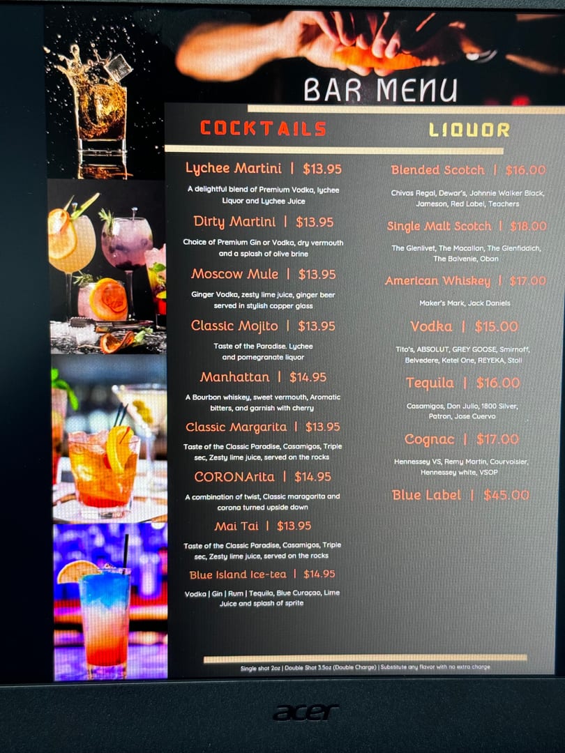 Restaurant bar menu displaying various cocktails and liquor options with vibrant drink photos.